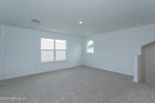 empty room with carpet and baseboards