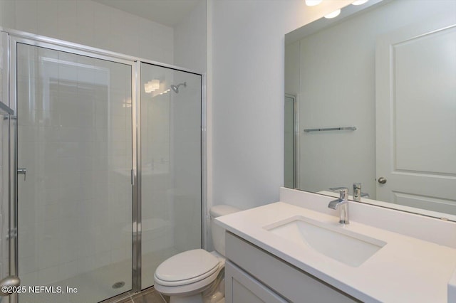 full bath featuring a shower stall, toilet, and vanity