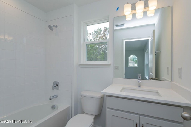 full bathroom with toilet, vanity, and shower / bath combination