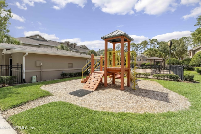 view of jungle gym featuring a yard