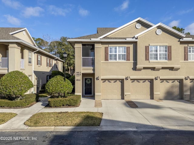 townhome / multi-family property with a garage