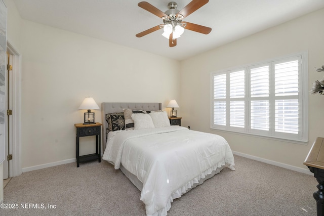 bedroom with light carpet and ceiling fan