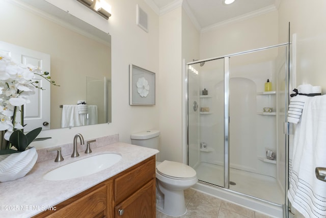 bathroom featuring crown molding, tile patterned flooring, vanity, toilet, and walk in shower