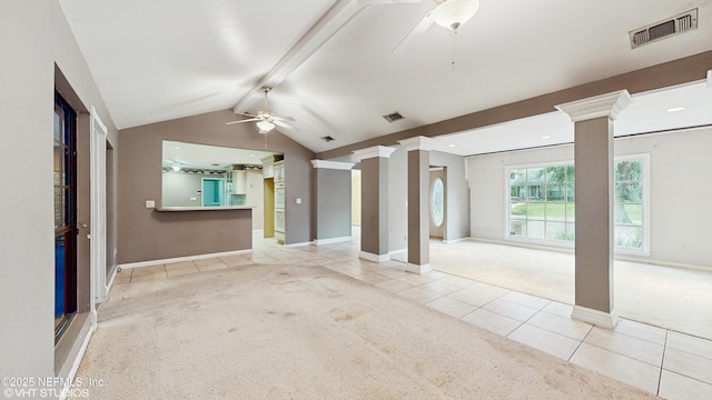 unfurnished living room with light colored carpet, vaulted ceiling with beams, ceiling fan, and ornate columns