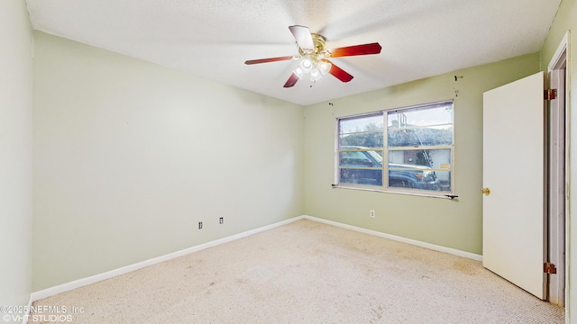 unfurnished room featuring ceiling fan and a textured ceiling