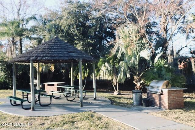 view of property's community with exterior kitchen and a gazebo