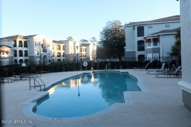 view of pool featuring a patio