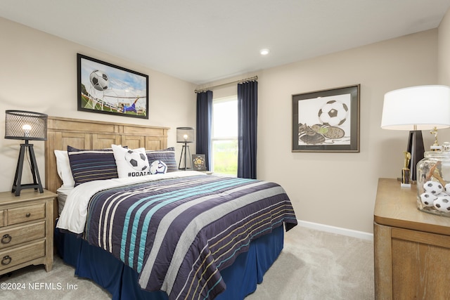 bedroom featuring light carpet