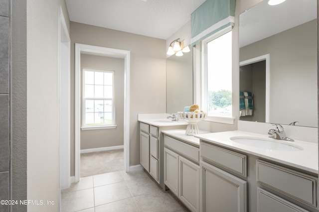 bathroom featuring vanity and tile patterned flooring