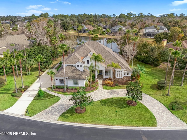 aerial view with a water view and a residential view