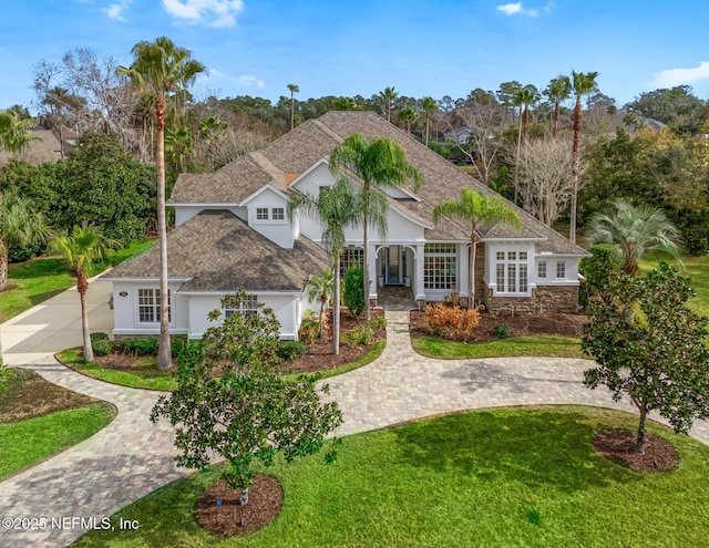 view of front of home with a garage and a front yard