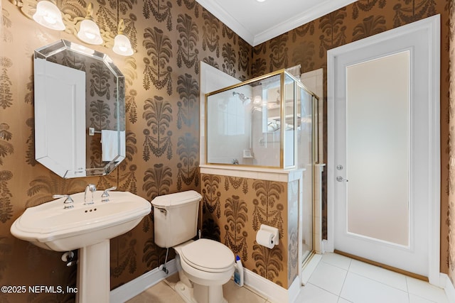 bathroom featuring toilet, wallpapered walls, a shower stall, and tile patterned floors