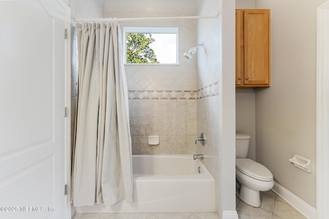 full bathroom featuring shower / tub combo, tile patterned flooring, toilet, and baseboards