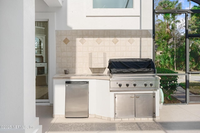 view of patio / terrace featuring exterior kitchen and grilling area