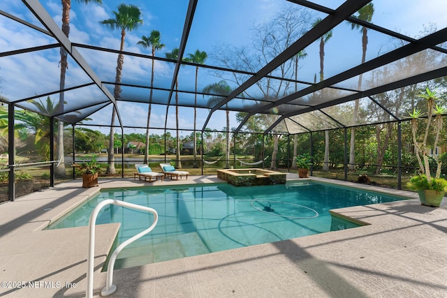 view of swimming pool featuring a lanai, a patio area, a pool with connected hot tub, and a water view