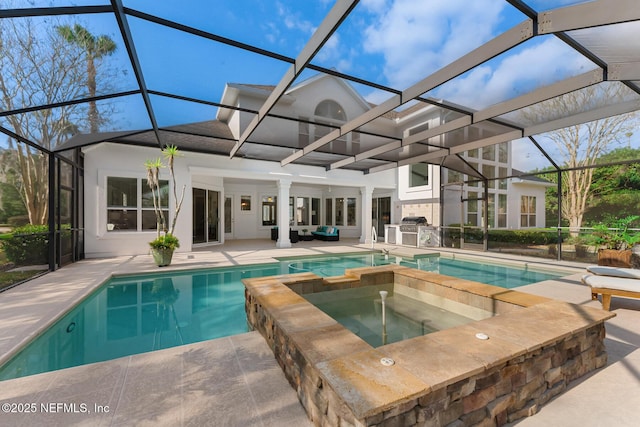 view of swimming pool with glass enclosure, a pool with connected hot tub, a patio area, and outdoor lounge area