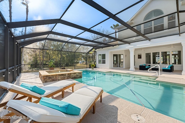 view of swimming pool featuring glass enclosure, a pool with connected hot tub, an outdoor living space, and a patio