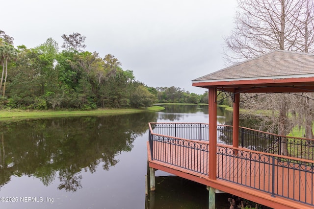 dock area with a gazebo and a water view