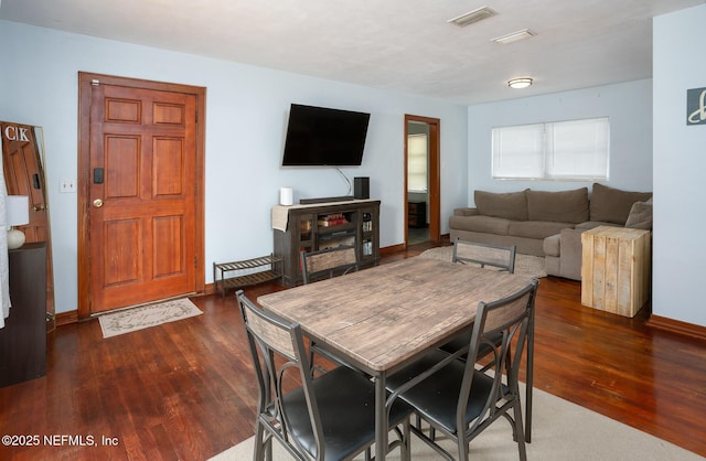 living room with dark hardwood / wood-style flooring