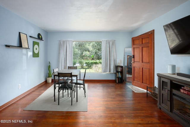 dining space featuring dark hardwood / wood-style floors