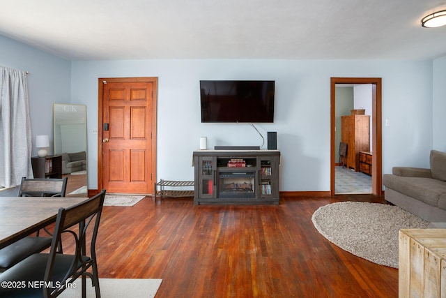 living room with dark wood-type flooring