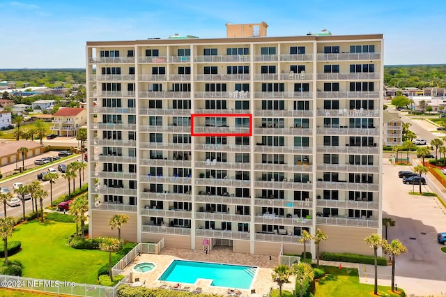 view of property featuring a community pool