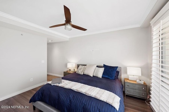 bedroom with ceiling fan, ornamental molding, and dark wood-type flooring