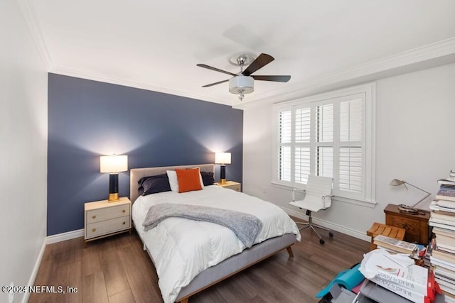 bedroom featuring dark hardwood / wood-style floors, ceiling fan, and ornamental molding