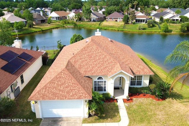 bird's eye view with a water view