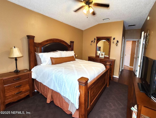 carpeted bedroom featuring ceiling fan, lofted ceiling, and a textured ceiling