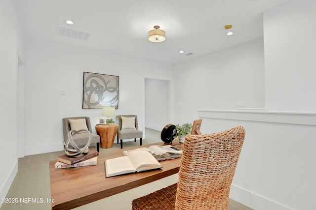 living area featuring light colored carpet