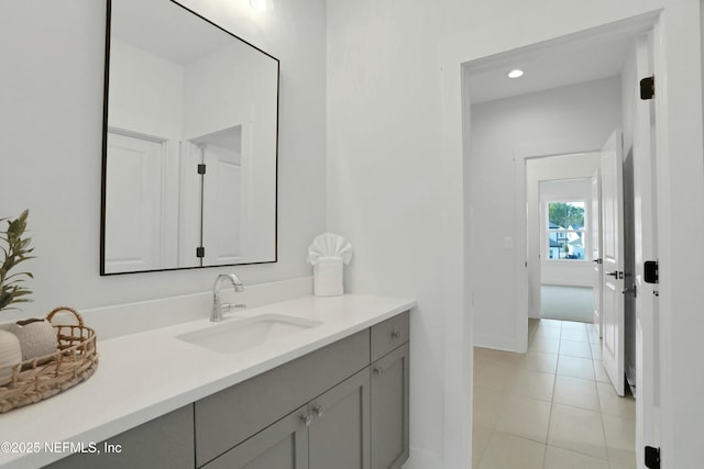 bathroom with tile patterned floors and vanity