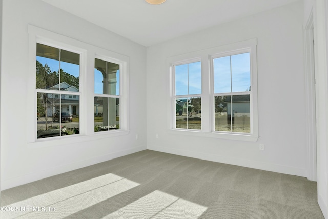 empty room with light colored carpet