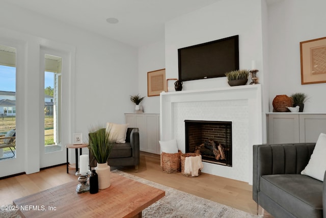 sitting room featuring light hardwood / wood-style floors