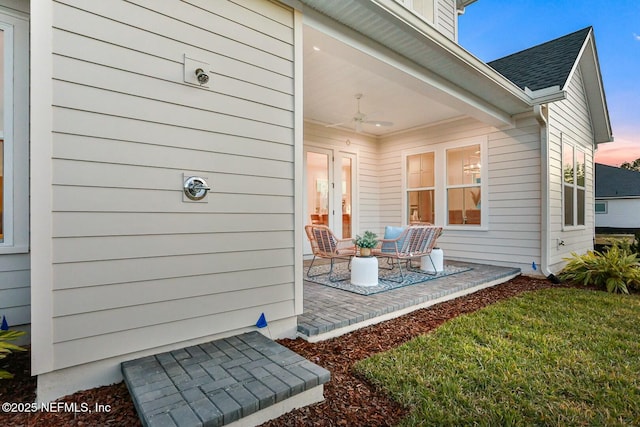 exterior space featuring ceiling fan