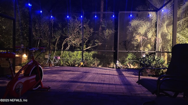 patio at night with glass enclosure