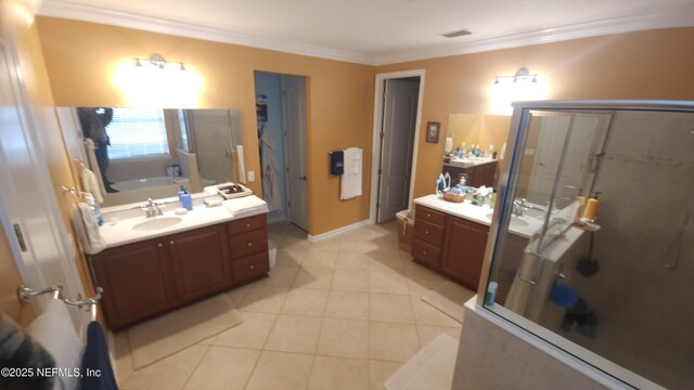 bathroom featuring tile patterned flooring, vanity, ornamental molding, and separate shower and tub