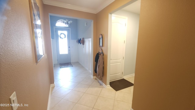 tiled entryway with ornamental molding