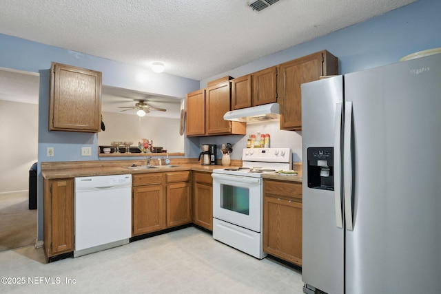 4084 Stillwood Dr, Jacksonville, FL 32257 - kitchen featuring sink, white appliances, a textured ceiling, and ceiling fan