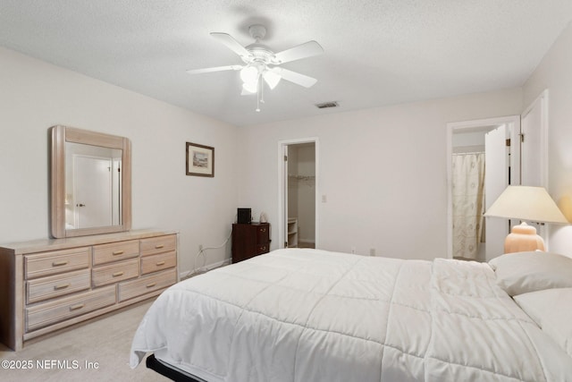 4084 Stillwood Dr, Jacksonville, FL 32257 - bedroom with a spacious closet, ceiling fan, light carpet, a textured ceiling, and a closet