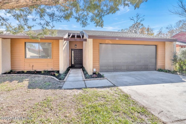 ranch-style house featuring a garage