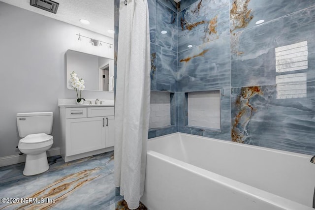 full bathroom with vanity, toilet, a textured ceiling, and shower / bath combo