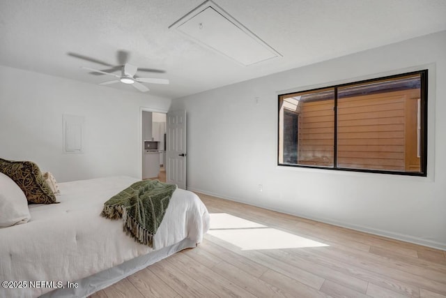 bedroom with ceiling fan and light hardwood / wood-style floors