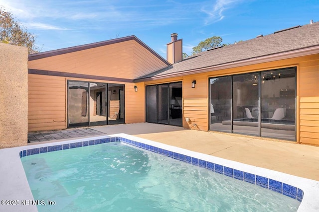 view of pool featuring a patio