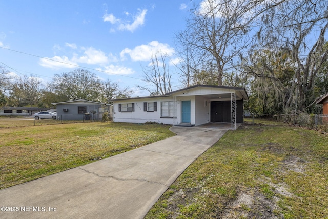 view of front facade featuring a carport and a front yard