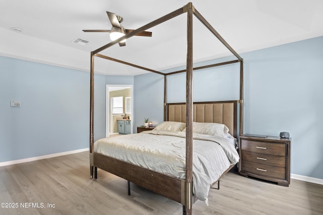 bedroom featuring ceiling fan, connected bathroom, and light hardwood / wood-style floors