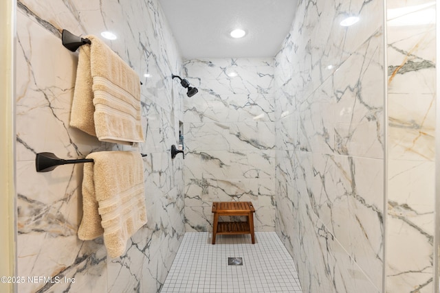 bathroom featuring tiled shower