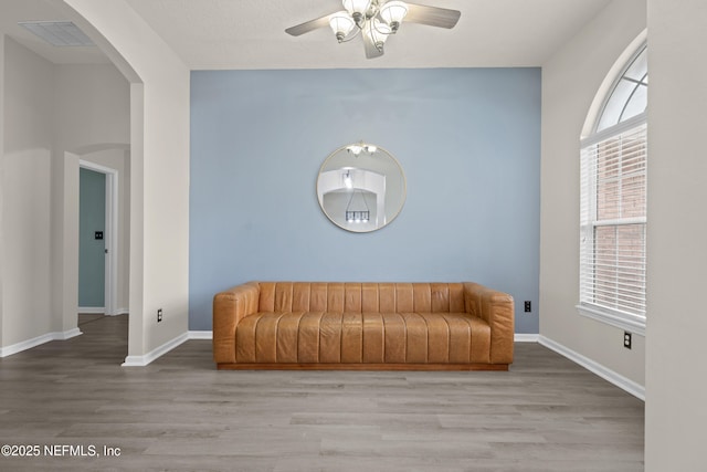 sitting room featuring ceiling fan and light wood-type flooring