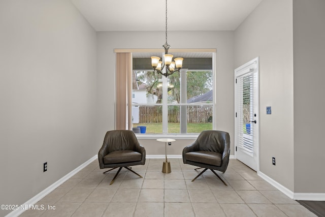 sitting room with a notable chandelier and light tile patterned floors