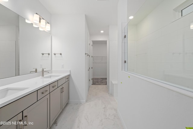 bathroom featuring vanity and a tile shower